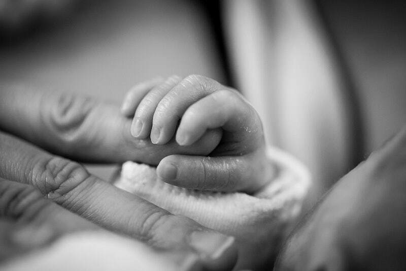 Free baby holding father's hand image, public domain CC0.