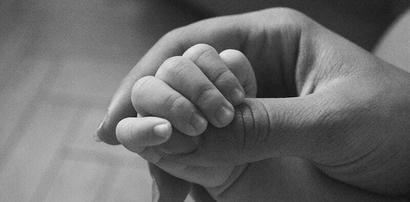Newborn gripping or grasping. Original public domain image from Wikimedia Commons